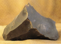 Despite the discovery of copper, flint mining became more sphisticated, and flint tools were made to copy the smooth finish of metal. This is a worked flint core with several flakes already taken off.