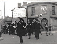 Mock funeral for demise of the Thetford Flyer. Procession coming into Guildhall Street from Churchgate Street, Bury St Edmunds. Picture by Tom Epton and kindly supplied by him for use in this Chronicle.