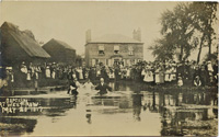A postcard view of a baptism being carried out at West Row in 1917. (Author's collection)