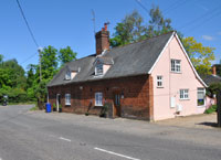 Two cottages at Fornham All Saints built by Sir Thomas Gery Cullum in 1842.